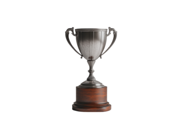 A gleaming silver trophy on a rich wooden base