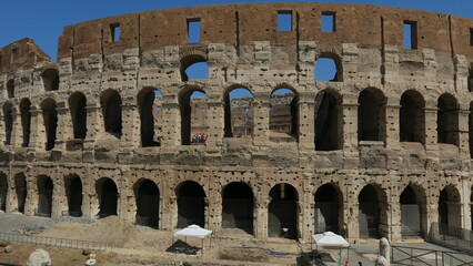 Explore the iconic Colosseum, a symbol of Roman power.  Discover its history and architecture in this stunning photo.