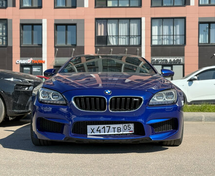 BMW M6 COMPETITION EDITION blue parked on street. Exterior of Blue BMW M6 GT3 F12, F13, F06 sport coupe manufactured by the German automobile manufacturer on parking lot.