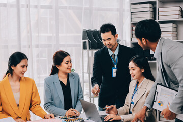 Team of financial advisory services. Asian advisor showing plan of investment to clients in the consultancy office..