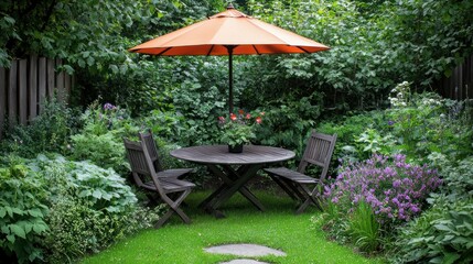 Obraz premium Small, secluded outdoor dining area under an orange umbrella. Lush garden setting with various plants and flowers