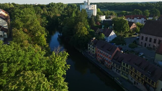 Aerial drone view of the Rednitz River in southern Nuremberg, Germany .
