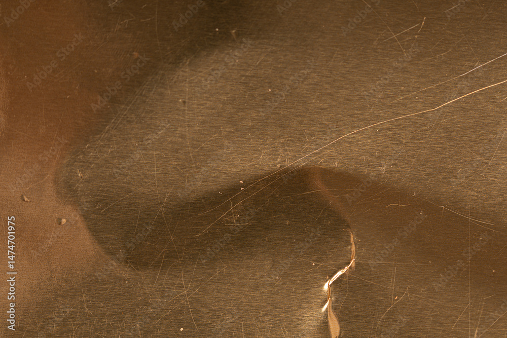 Poster High-resolution image of a scratched golden metal texture. Perfect for backgrounds and design projects.