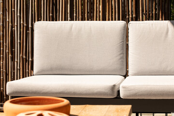 Relaxing outdoor sofa with beige cushions, perfect for patios and gardens.  Enjoy the comfort and...