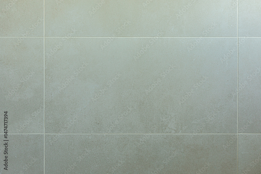 Poster high-resolution image of a grey speckled tile wall, perfect for backgrounds and design projects.