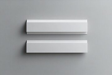Two blank white rectangular objects,  horizontally aligned, on a neutral background.  The objects are  similar in shape and size