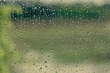Water drops from the rain on the car window
