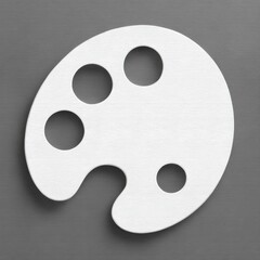 Obraz premium White artist's paint palette isolated on a gray background, studio shot.