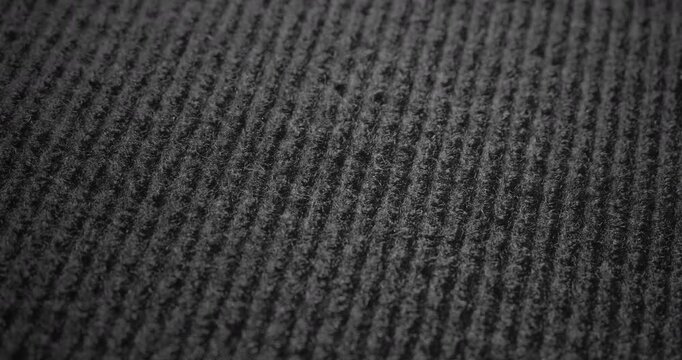 Dark Linear Textured Surface in Motion. Video showcasing a dark surface with fine linear patterns and smooth camera movement.