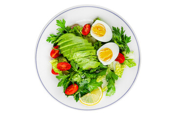 Avocado salad, boiled egg, tomato, green leaf lettuce, vegetable dish fresh delicious gourmet food background on the table rustic food top view copy space keto and paleo diet vegetarian food