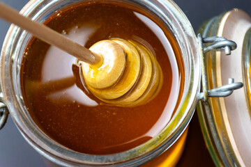 Honey dipper in a honey
