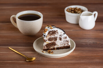 Piece of Pancho Cake. Homemade biscuit cake with sour cream, pineapple and cup of chicory on a wooden table. Vegan dessert. Sugar, lactose and gluten free.