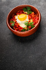 Fried egg tomatoes shakshuka vegetable dish appetizer fresh delicious gourmet food background on the table rustic food top view copy space vegetarian  food