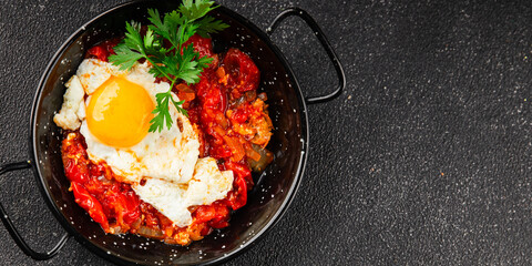 Fried egg tomatoes shakshuka vegetable dish appetizer fresh delicious gourmet food background on the table rustic food top view copy space vegetarian  food