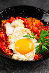 Fried egg tomatoes shakshuka vegetable dish appetizer fresh delicious gourmet food background on the table rustic food top view copy space vegetarian  food