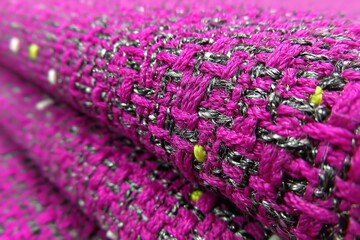 Colorful woven fabric displays vibrant purple tones with intricate patterns, perfect for textile enthusiasts and design inspirations