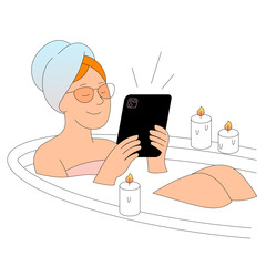 Enjoy a Relaxing Bath with a Tablet Surrounded by Soft Candles for a Peaceful Ambiance