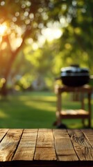 backyard barbecue concept with empty wooden table and grill in soft focus