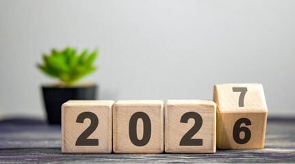 New year 2026 concept. Change of year 2026 to 2027, coup.