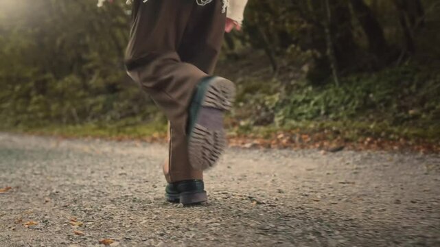 footsteps of a man in leather boots on a forest
