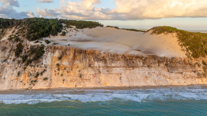 Rainbow Beach, Queensland Australia, aerial drone view coloured sand cliffs, beach and ocean, holiday destination
