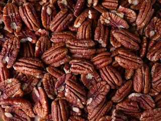 raw organic pecan nuts pattern background.
