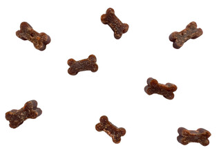 Dog bone treats scattered on white background, pet food concept