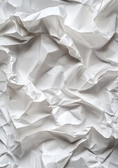 Obraz premium Crumpled white paper texture. Wrinkled, creased, and folded sheets of white paper create a visually interesting abstract pattern. 