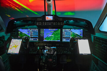 Flight simulator cockpit, plane airplane aeroplane pilot training, commercial transportation safety © Cynthia