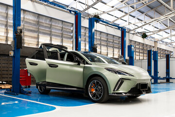 Modern Electric Car in Auto Repair Workshop