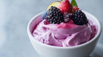 Close-up of a bowl of ice cream. the ice cream is a light pink color and has a smooth texture.
