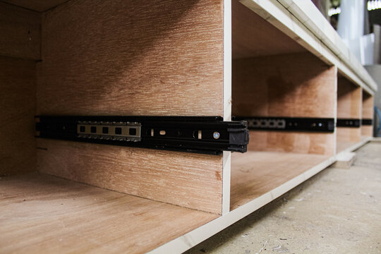 Explore the functionality of double extension drawer slides designed for furniture, particularly cabinets. These mechanisms allow for full drawer extension, maximizing accessibility and storage conven