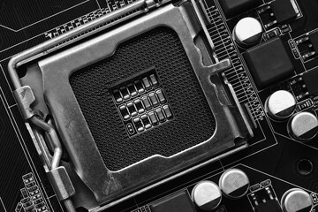 Old black motherboard of computer equipment focusing on CPU slot background, Technology background.