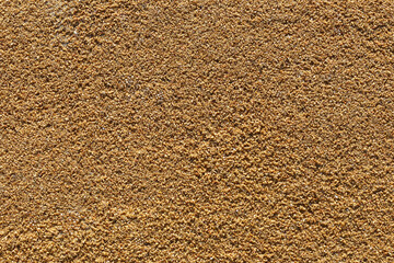 Brown epdm flooring, where the material is shaped like sand but is soft.