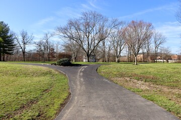 The white gazebo in the park on a sunny winter day.