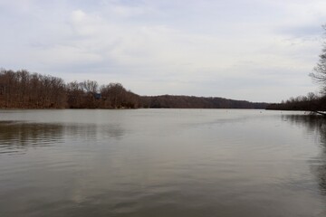 Fototapeta premium The lake in the countryside on a cloudy winter day.