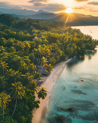 Sunset over tropical beach lined with palm trees and mountains in background