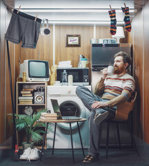 Portrait of a happy single man living in a small studio apartment