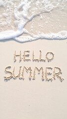 summer background with finger written text on sand and sunny beach vibe