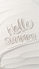 summer background with finger written text on sand and sunny beach vibe