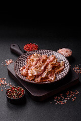 Cooked crispy bacon, slices of roast pork for an English breakfast. Fried bacon