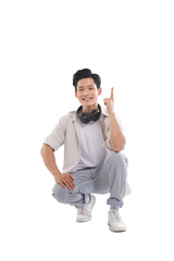 Asian student sitting posing on white background