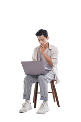 portrait of young asian man sitting on chair posing