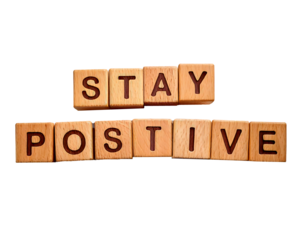 Stay positive text on wooden cubes; motivation and inspiration concept on transparent background and white background 