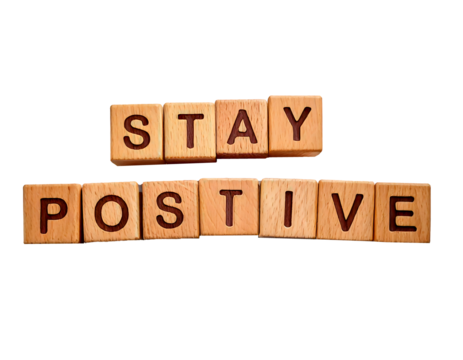 Stay positive text on wooden cubes; motivation and inspiration concept on transparent background and white background 