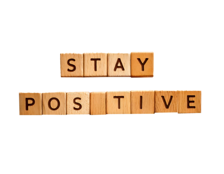 Stay positive text on wooden cubes; motivation and inspiration concept on transparent background and white background 