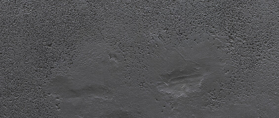 Background of compacted black gravel wall with uniform texture