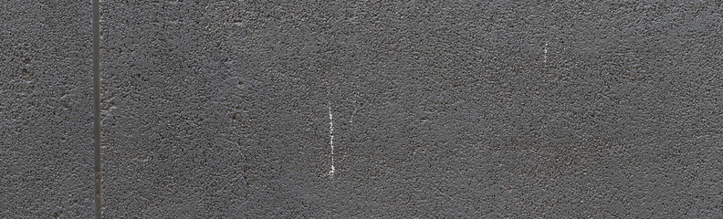 Background of compacted black gravel wall with uniform texture