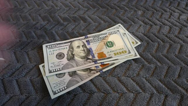 Financial monay concept showing someone counting dollar currency