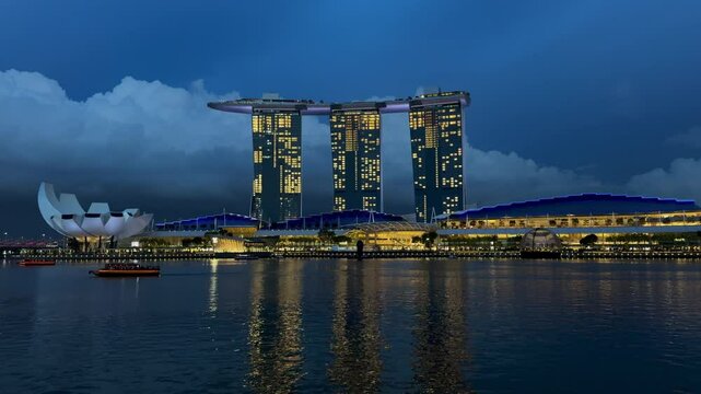 Singapore &ndash; October 9, 2024: Night View of Marina Bay Sands and ArtScience Museum Illuminated and Reflected on Marina Bay Waters